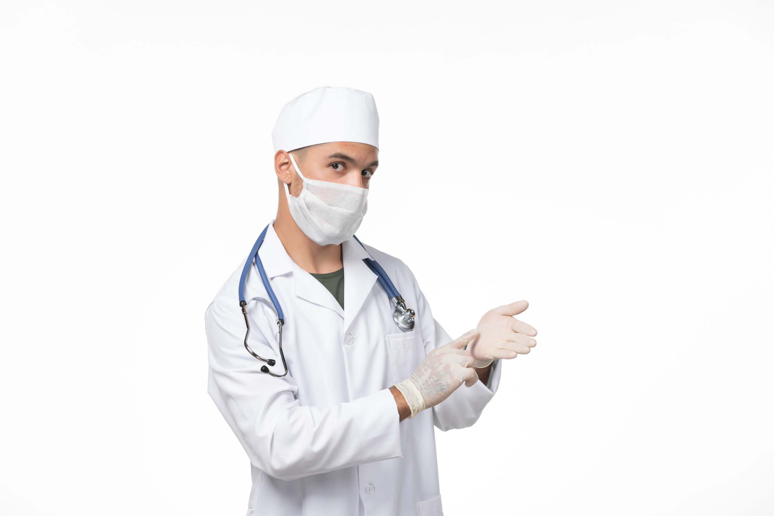 front-view-male-doctor-medical-suit-wearing-mask-due-covid-white-wall-illness-covid-pandemic-virus-disease